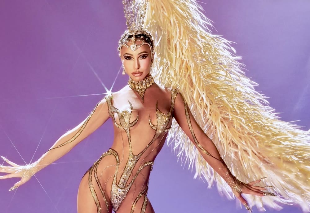 Carnival performer in a crystal costume and feathered wing